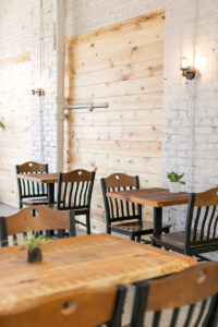 Dining area with two seated wooden tabletops