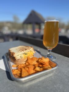 Grilled Cheese Sandwich with potato chips and belgian tripel beer