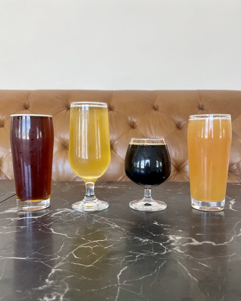 Four new craft beers lined up on a table